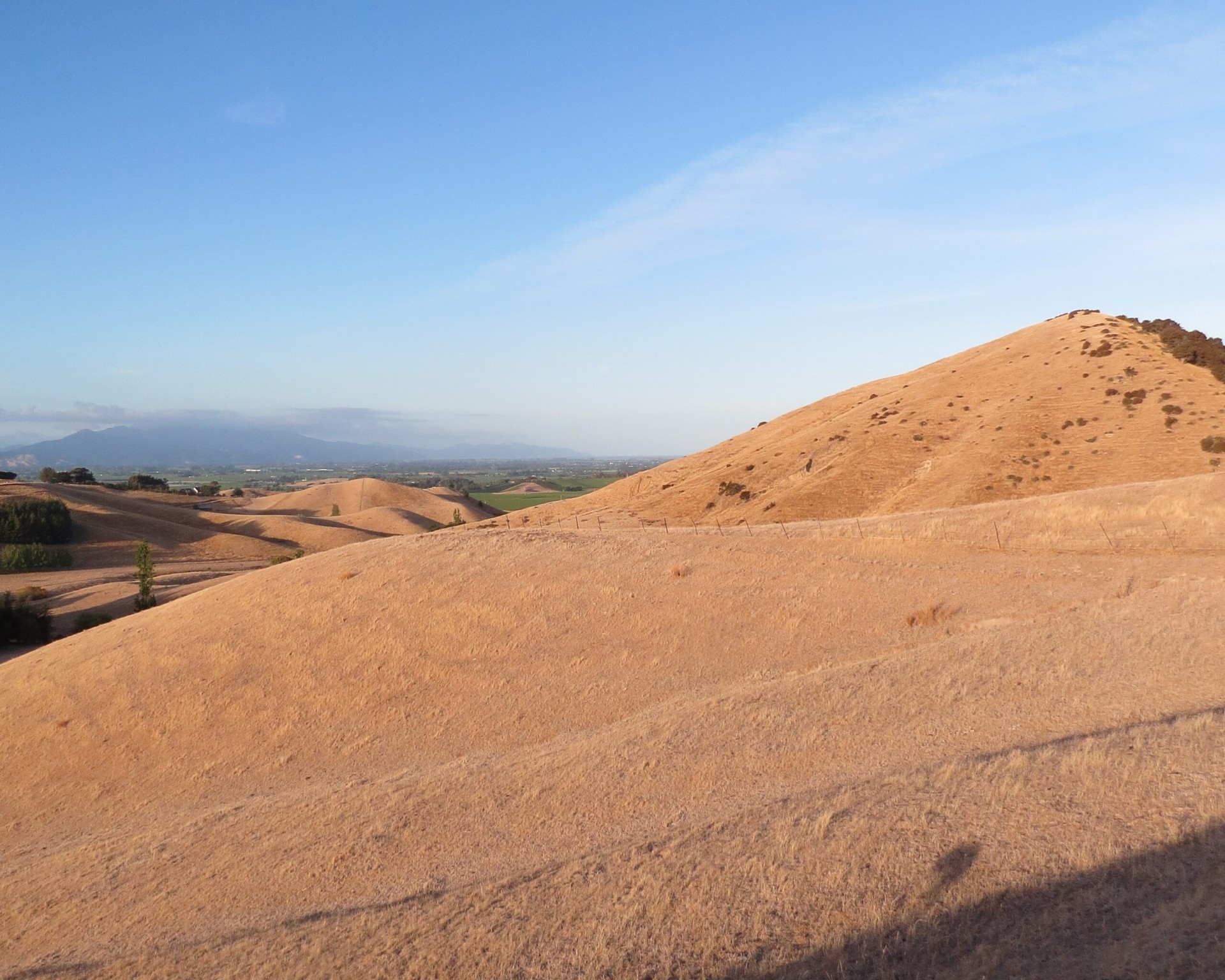 Sun-dried hills over farmland, illustrating the dry conditions possible for northern and eastern areas under a strong El Nino.