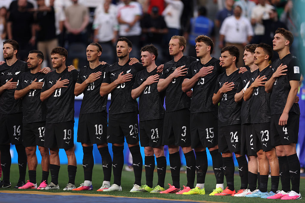 The All Whites stand for the national anthem before their FIFA World Cup opener.