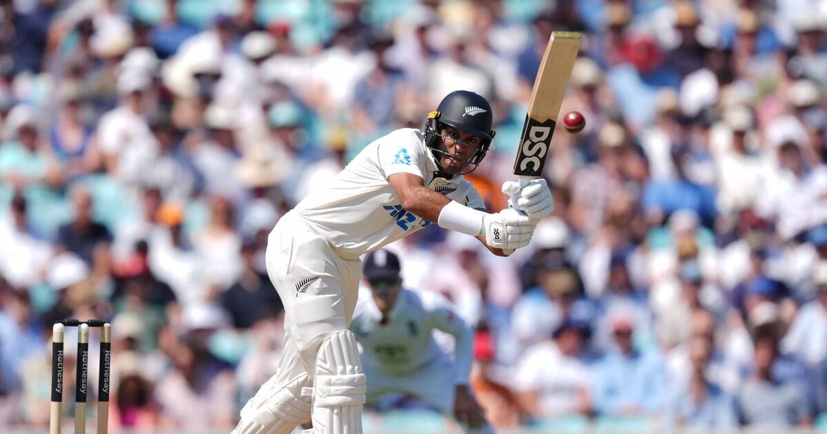 Black Caps batter Rachin Ravindra plays a front-foot stroke in his Test whites in front of a packed crowd, on his way to an unbeaten 60 at Trent Bridge.